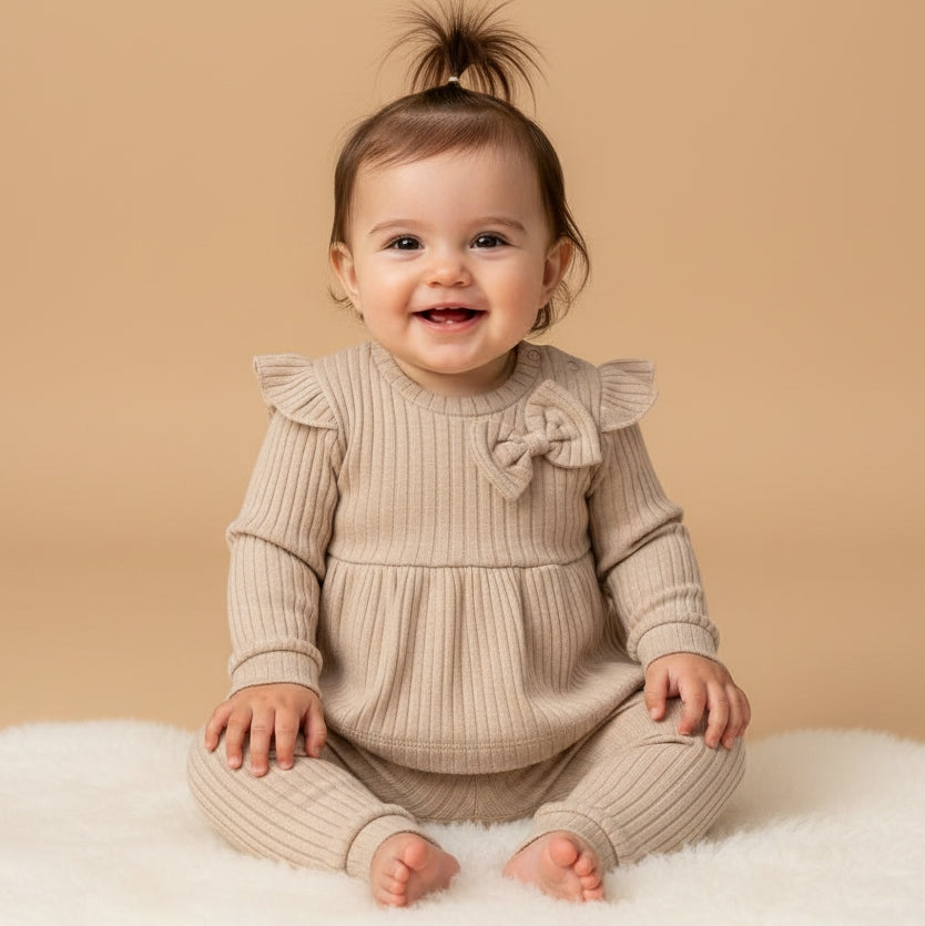 Beige Knitted Baby Outfit – Peplum Top & Ribbed Pants Set with Bow Detail for Cozy Elegance
